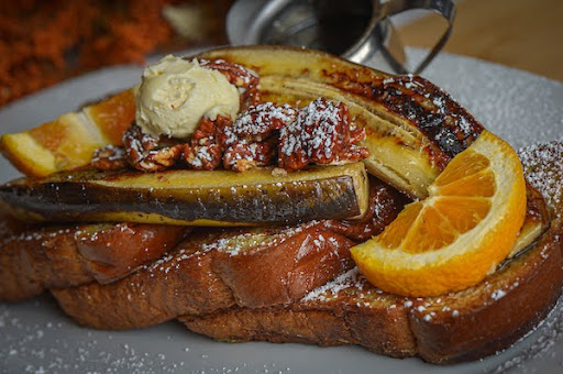 Best Brunch Spots in Downtown Las Vegas: Hash House A Go Go Leads the Pack 2 Banana pecan French toast with whipped butter and orange slices at Hash House A Go Go inside The Plaza in Downtown Las Vegas