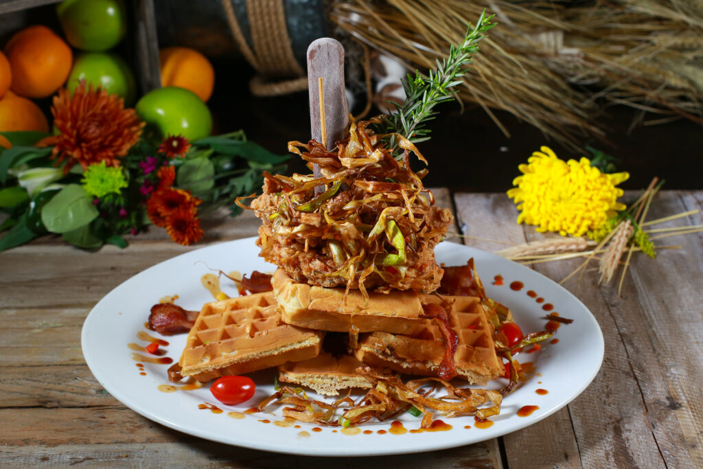 Oversized Portions: Why Hash House A Go Go is Famous for Its Big Plates 2 Oversized fried chicken and waffle tower at Hash House A Go Go Plaza Downtown Las Vegas