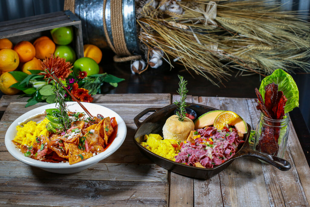 Hash House A Go Go at The Plaza: The Hidden Gem of Downtown Vegas 1 Brunch dishes at Hash House A Go Go at The Plaza Las Vegas featuring skillet hash with eggs and biscuit, spicy chilaquiles, and candied bacon